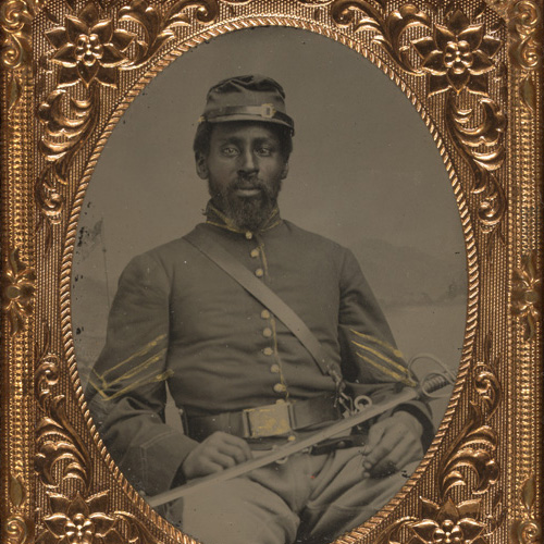 Tintype photograph of unidentified African American soldier in Union cavalry uniform with cavalry saber