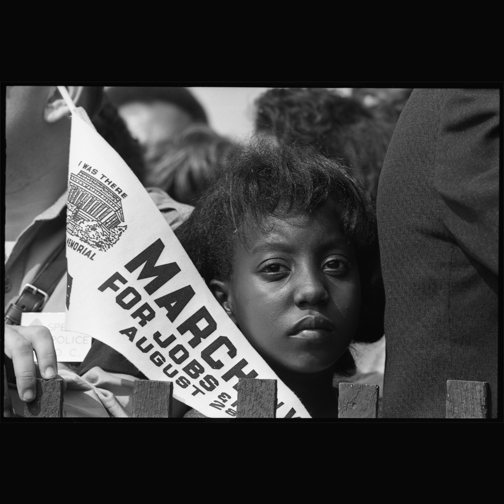 Photograph of a Young Woman (Edith Lee-Payne) at the Civil Rights March on Washington, DC, with a Banner